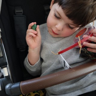 Child with Gummy Candy Container on Airplane