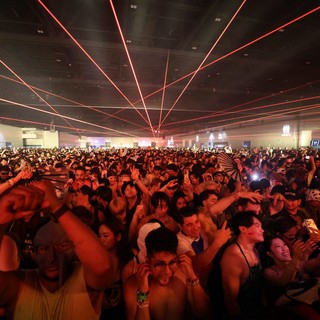 Red Laser Light Show Over Massive EDM Festival Crowd