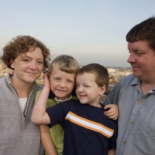 Family Portrait on City Rooftop at Dusk