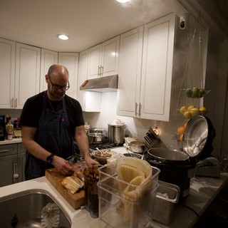 Home Chef Preparing Christmas Eve Dinner in Modern Kitchen