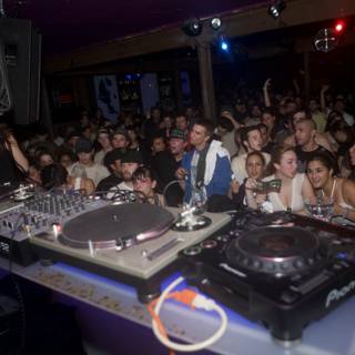 DJ Entertaining the Urban Crowd at Nightclub