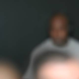 Blurry Portrait of a Man in a Dark Room