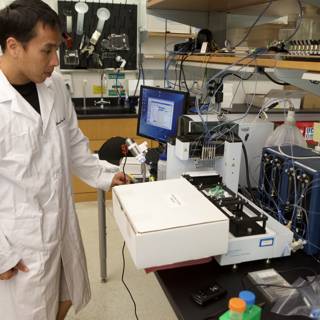 Lab Coat Scientist Working with Micro Bio Chips