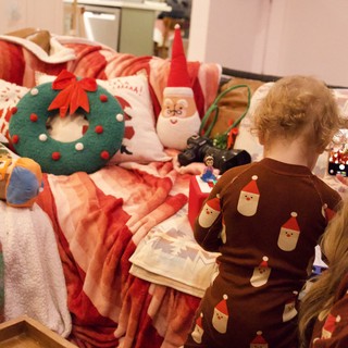 Toddler's Christmas Morning with Festive Decorations and Toys
