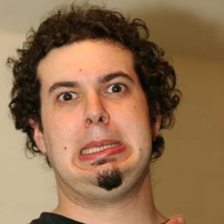 Curly-haired Man with a Funny Face