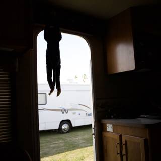 Daredevil Hangs from RV Window