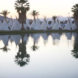 Reflections of Teepees on the Lake