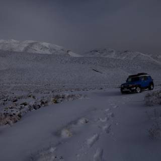 Blue SUV in the Snow