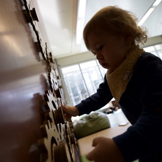 Young Child Engaged in Interactive Learning Play