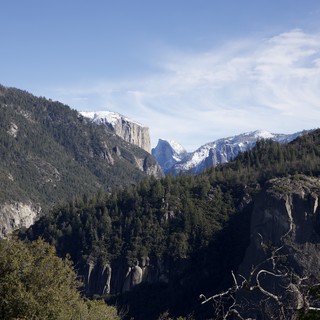 Snow-Capped Peaks Beyond Yosemite Valley Granite Cliffs
