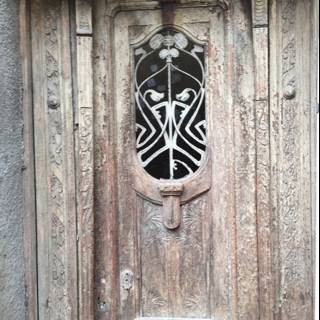 The Face on the Wooden Door