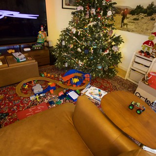 Christmas Morning Living Room with Scattered Toys and Decorations