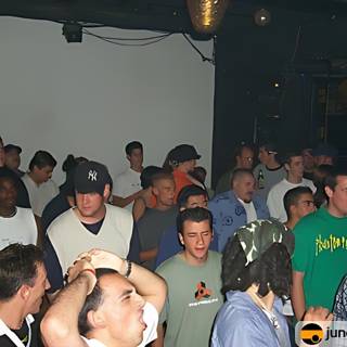 Nightclub Crowd with Man in Green Shirt