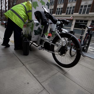 Delivery Cyclist Navigating Urban Streets in Hi-Vis Gear