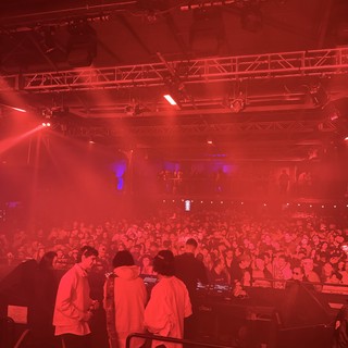 Electronic Music Concert Under Dramatic Red Stage Lighting