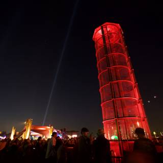 Red Tower Illuminates Urban Night Life