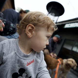 Young Child in Mickey Mouse Sweatshirt on Boat