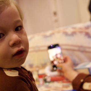 Young Child Playing with Drawing Toy on Christmas