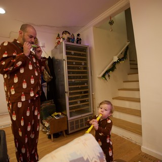 Father and Child's Matching Christmas Morning Fun