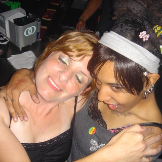 Two Friends Embracing at a Late Night Party