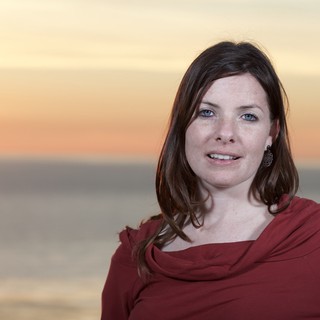 Woman in Red at Golden Hour Seaside