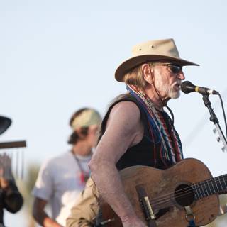 Willie Nelson strums his guitar at Coachella 2007