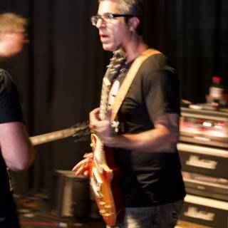 Brett Gurewitz playing the guitar at Glasshouse album release
