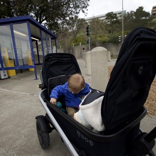 Young Child in Modern BOB Stroller at Transit Station