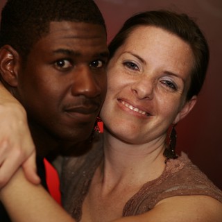 Couple Embracing at Evening Dance Event