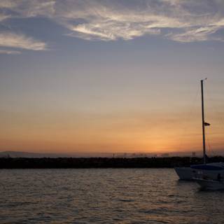 Sailboats on Lake at Sunset