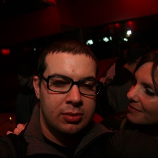 Two Friends Share a Moment at a Nightclub