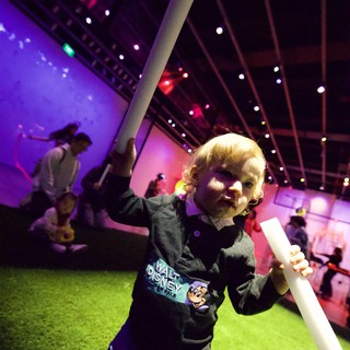 Toddler's Joyful Moment at Baby Rave Event