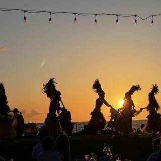 Silhouettes of Hula Dancers at Sunset on the Beach