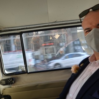 Masked Man Traveling in Moving Vehicle