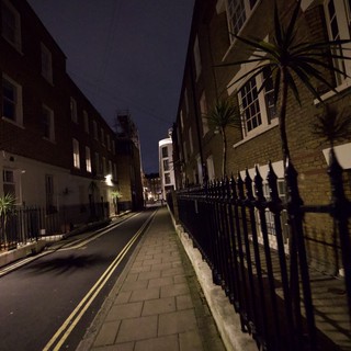 Dark London Street at Night with Iron Railings