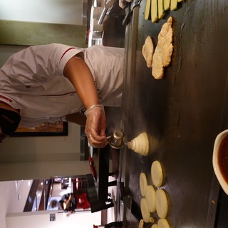 Japanese Hibachi Chef Preparing Teppanyaki Dinner