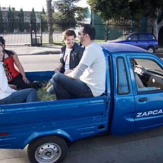 Group Ride in a Blue Pickup Truck