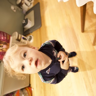 Curious Toddler in Kitchen on Christmas Morning