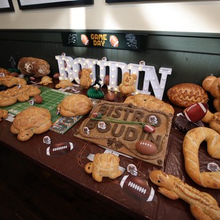 Game Day Football-Themed Bread Display with Illuminated Signage