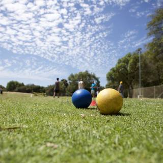 A Game of Bocce under the Blue Sky