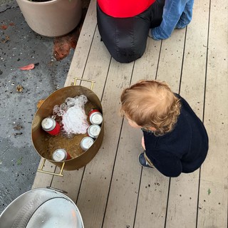 Child Observing Ice-Cold Drinks at Outdoor Gathering