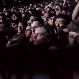 Cell Phone Light in a Sea of Faces