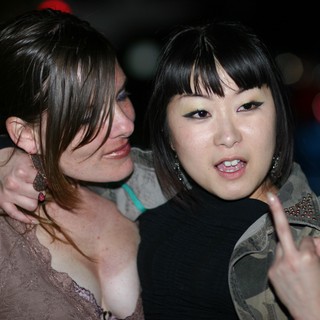 Two Friends Celebrating at Nighttime Event 2006