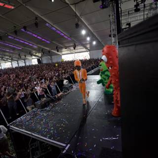 Orange Man on Stage with Confetti