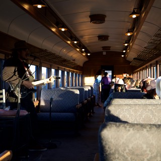 Banjo Player Performs on Vintage Train Journey
