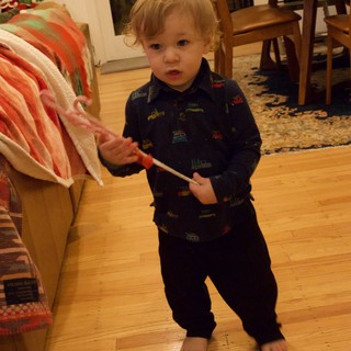 Toddler with Candy Cane on Christmas Morning