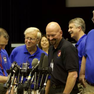 Press Conference with Blue Shirted Men