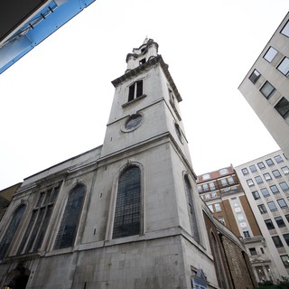 Historic Church Tower Rising Above Modern London Buildings