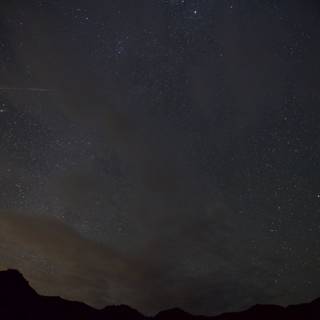 Shooting Star Over the Mountains