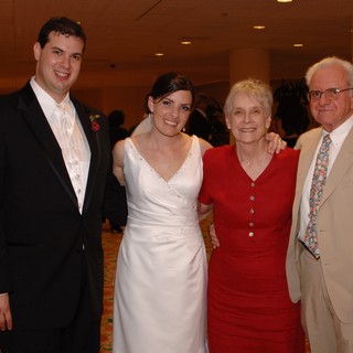 Newlyweds Pose with Family at Wedding Reception